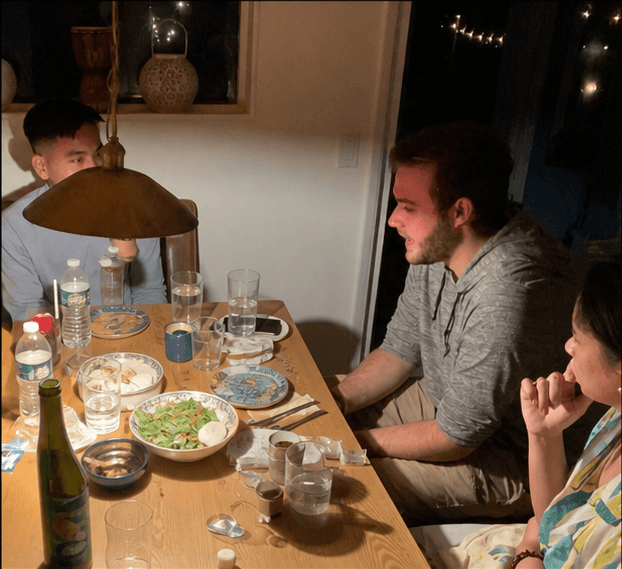 techie members sharing dinner at their Joshua Tree retreat